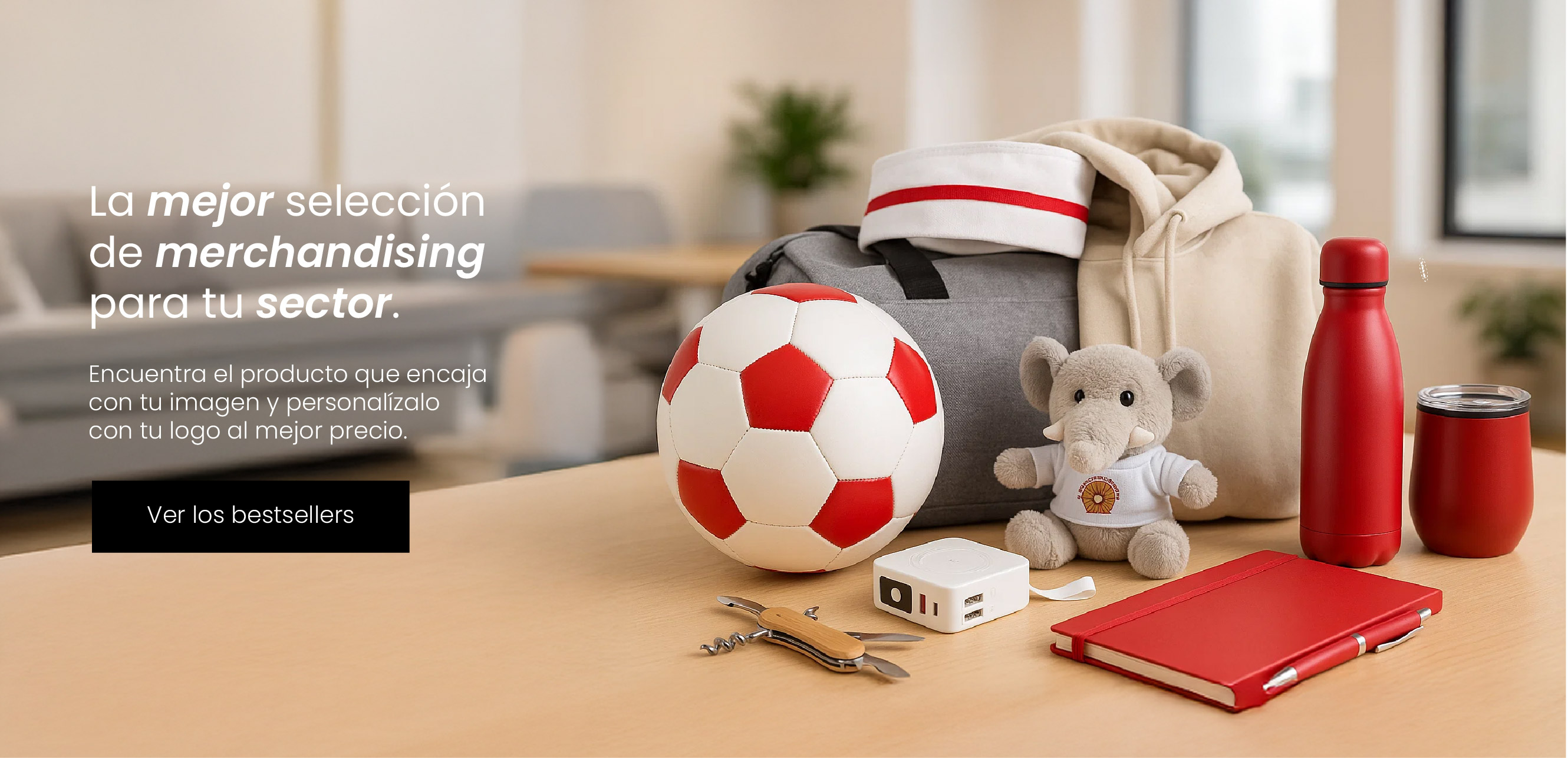 Selección de regalos promocionales personalizados sobre una mesa, incluyendo balón, mochila, sudadera, botella reutilizable, libreta, peluche y accesorios corporativos
